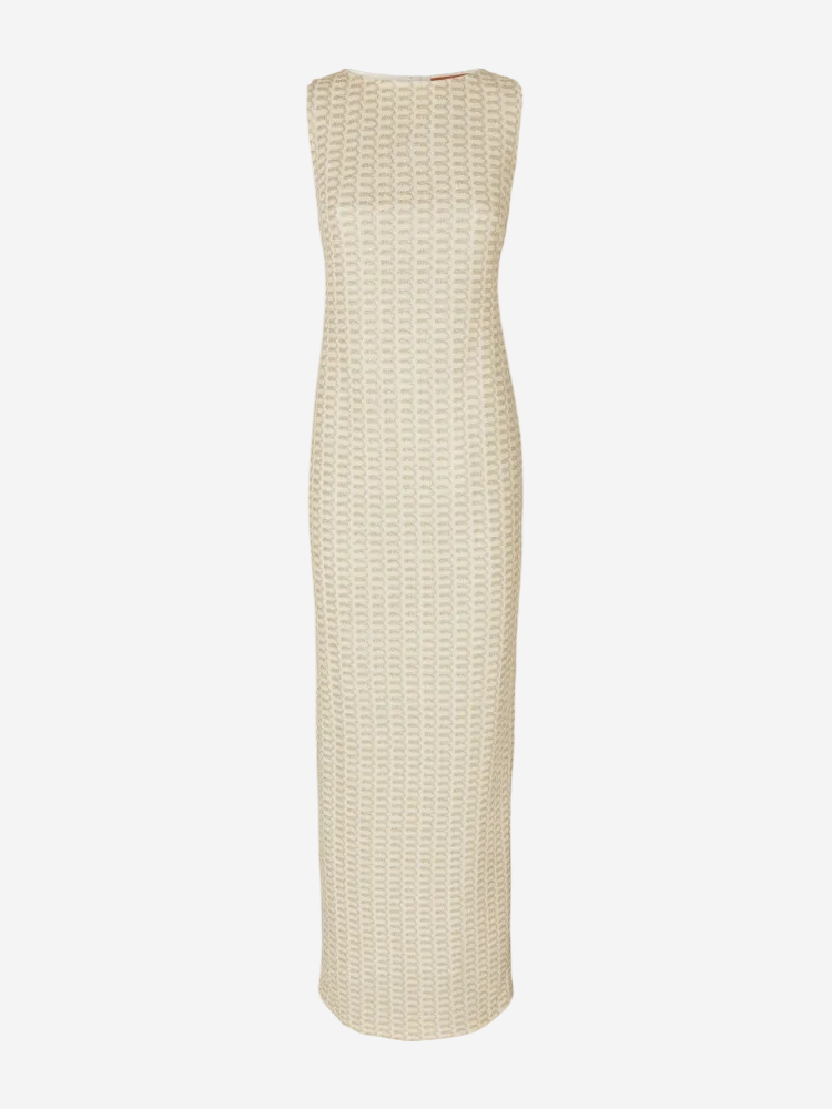 A sleeveless beige maxi dress made of tonal lace fabric, photographed against a white background.