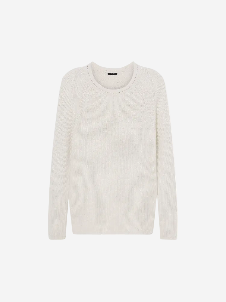 A round neck, long-sleeved, beige linen blend sweater.