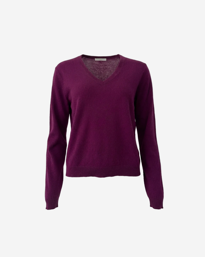 Purple sweater on a white background