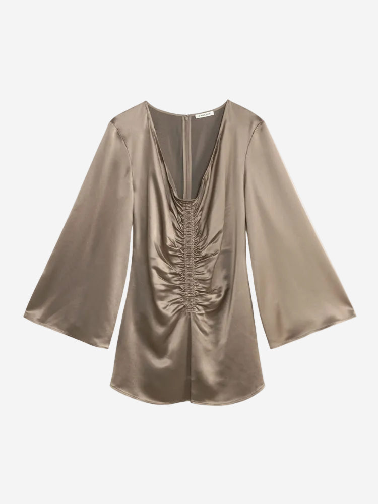 Gold satin blouse with ruched design on a white background