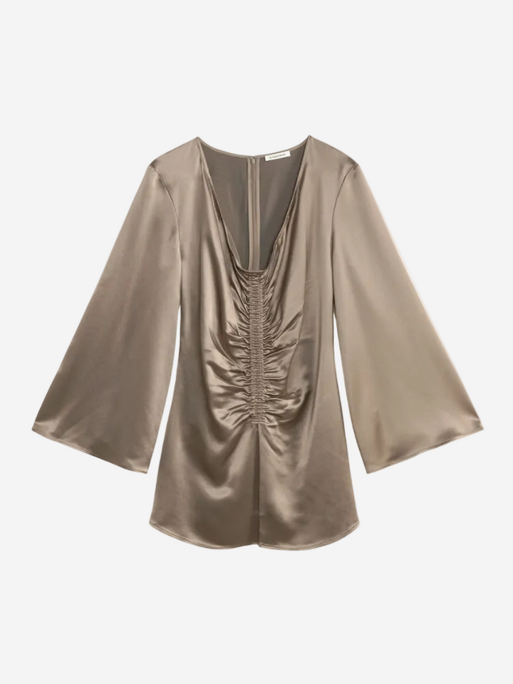 Gold satin blouse with ruched design on a white background