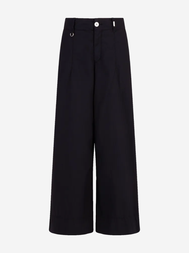 A pair of navy blue wide-leg trousers with a high waist and button fly closure.