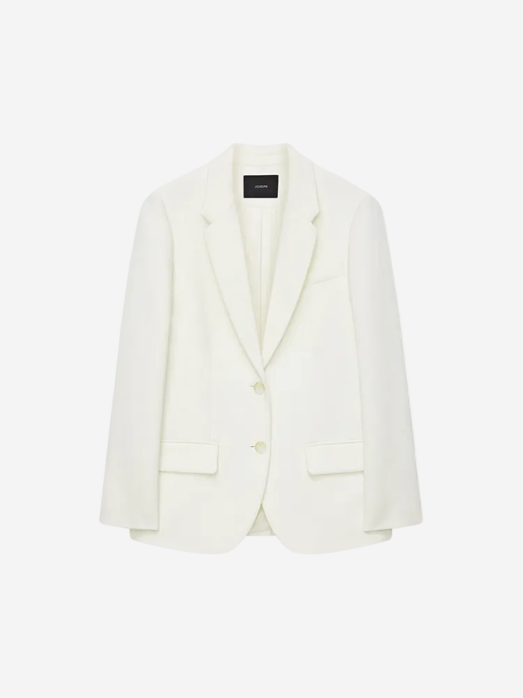 An ivory, single-breasted, regular fit blazer with shoulder padding, flap side pockets, and an inside chest pocket.
