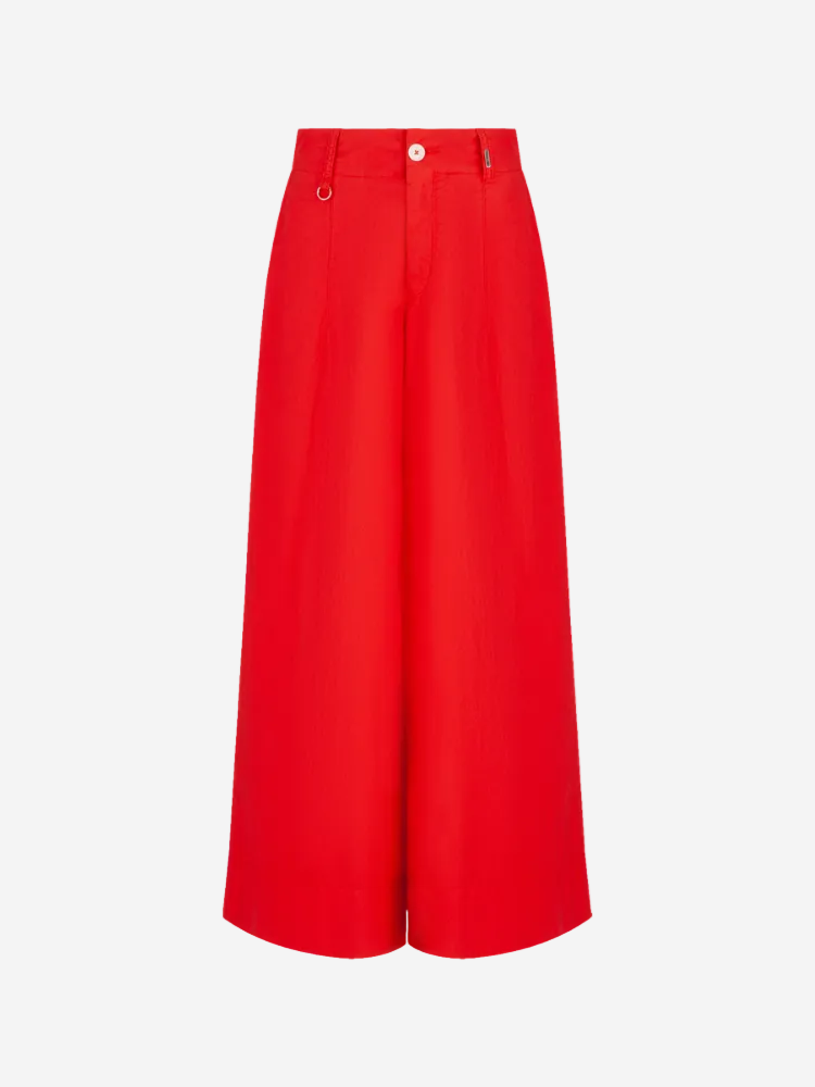 A pair of red culotte-style trousers with a high waist and wide legs.