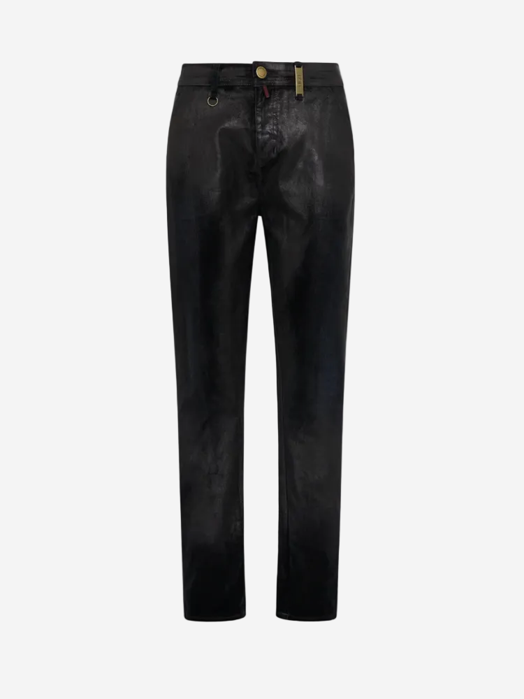 A pair of dark green denim pants with a 'leather' effect surface, fixed waistband, single metal button, belt loops, and a silver metal zip.