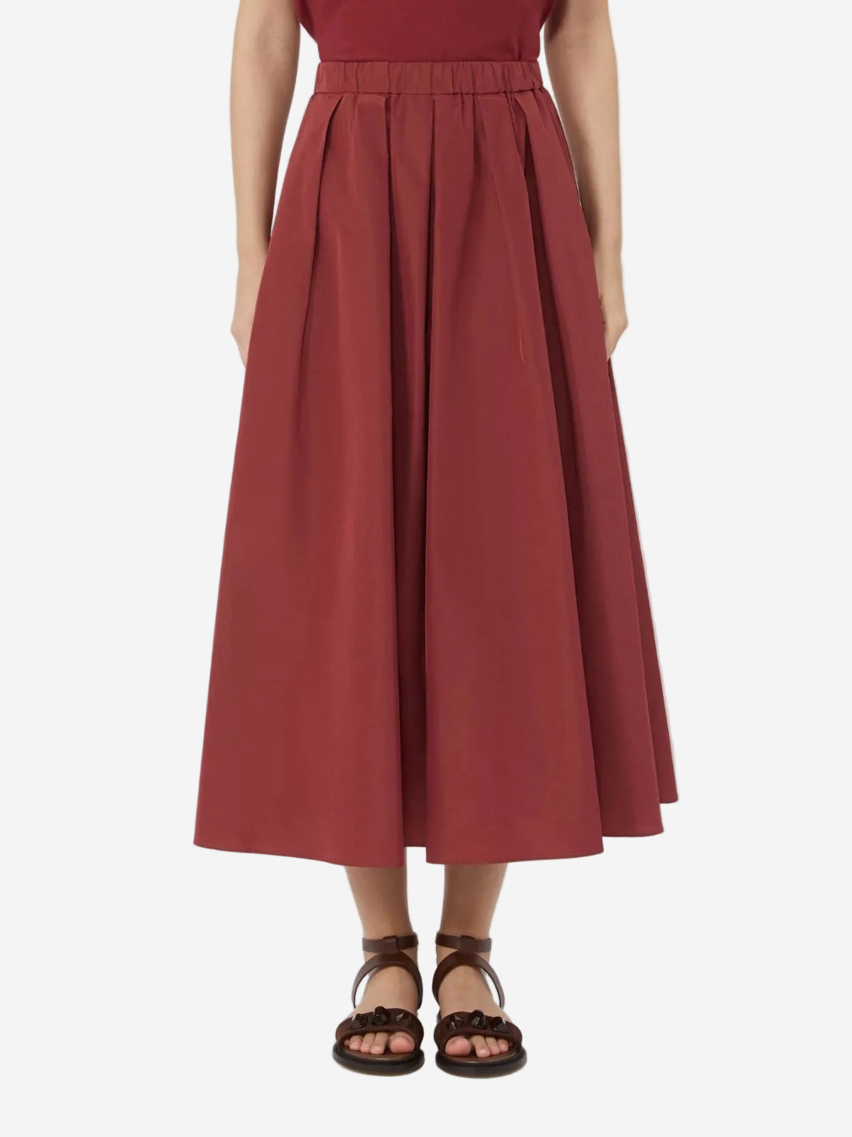Red dress worn by a person on a white background