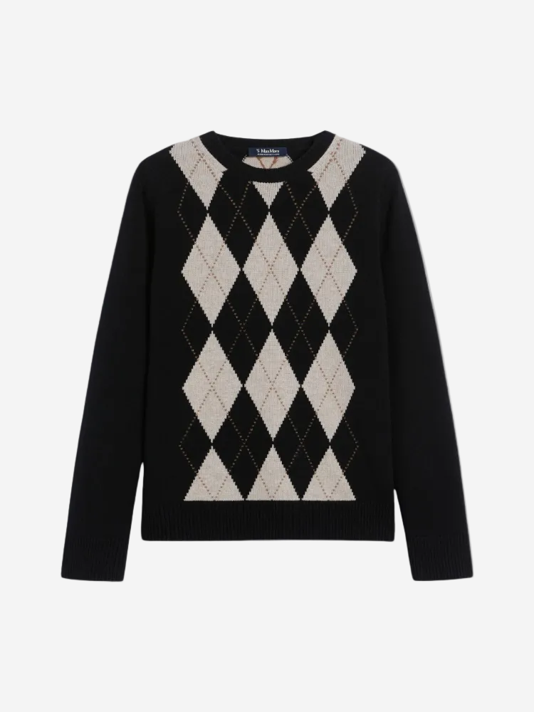 Black sweater with white argyle pattern on a white background