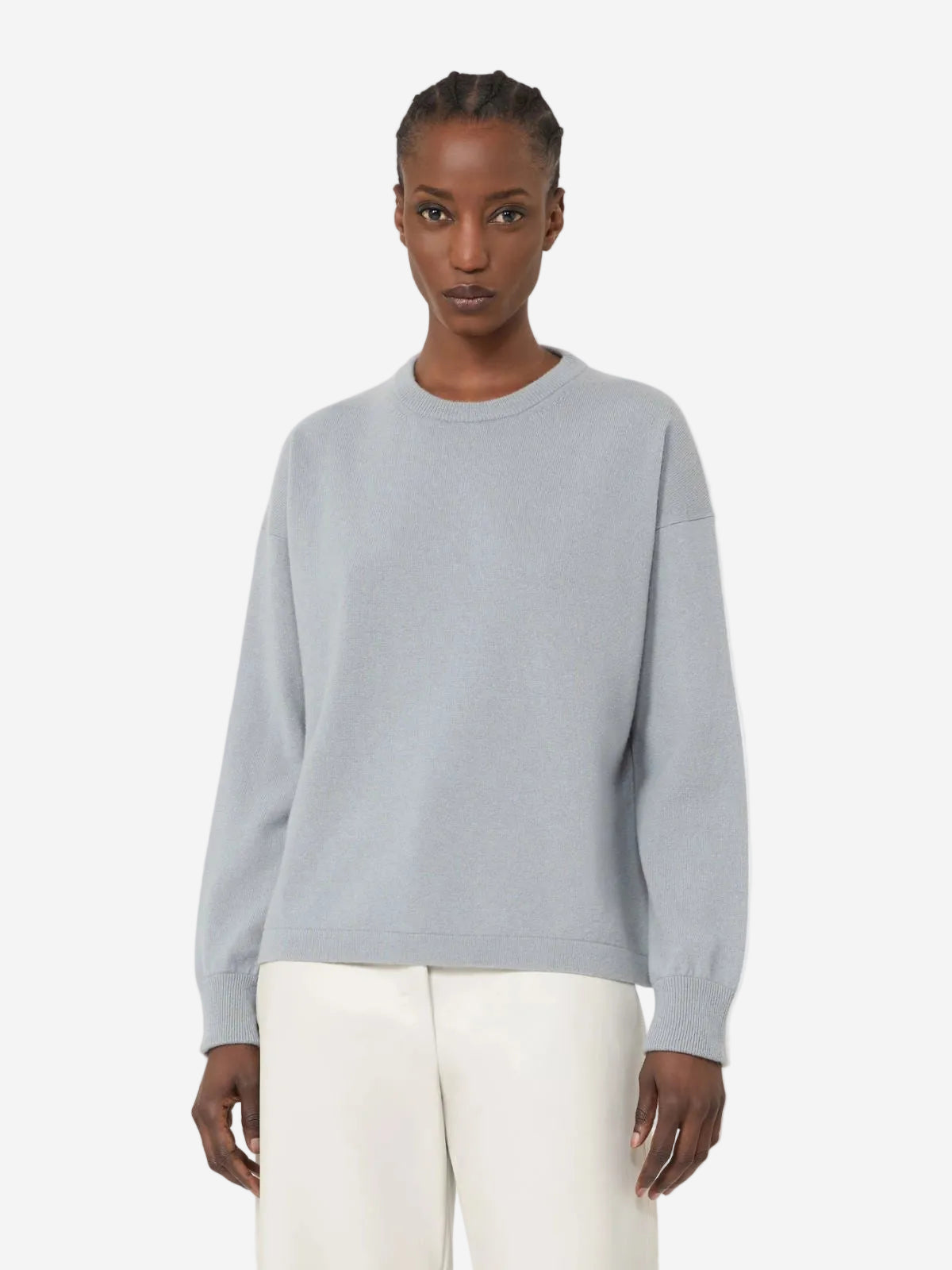 Person wearing a light gray sweater and white pants on a plain background, New Arrivals at Christensen Copenhagen