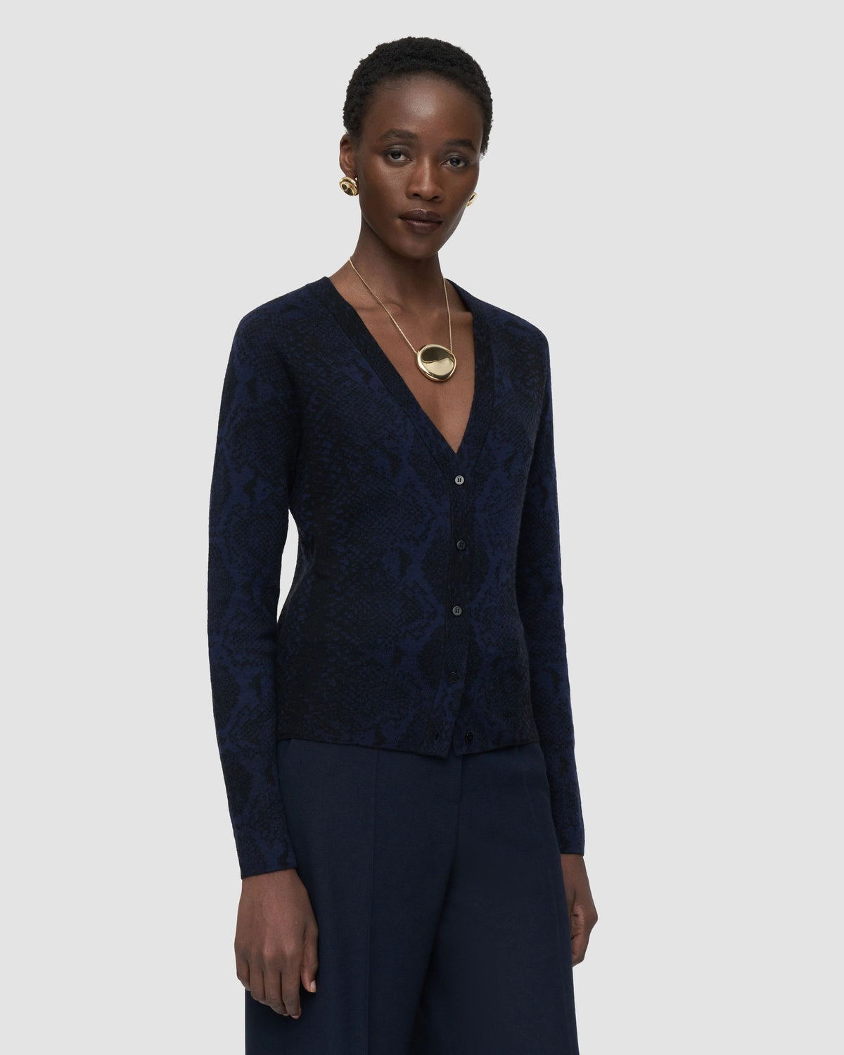 Back view of the JOSEPH Aisha cardigan showing the snake jacquard pattern across the back and sleeves
