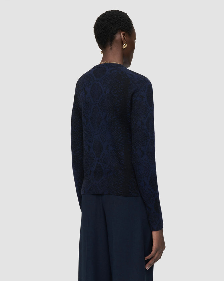 Back view of the JOSEPH Aisha cardigan showing the snake jacquard pattern across the back and sleeves