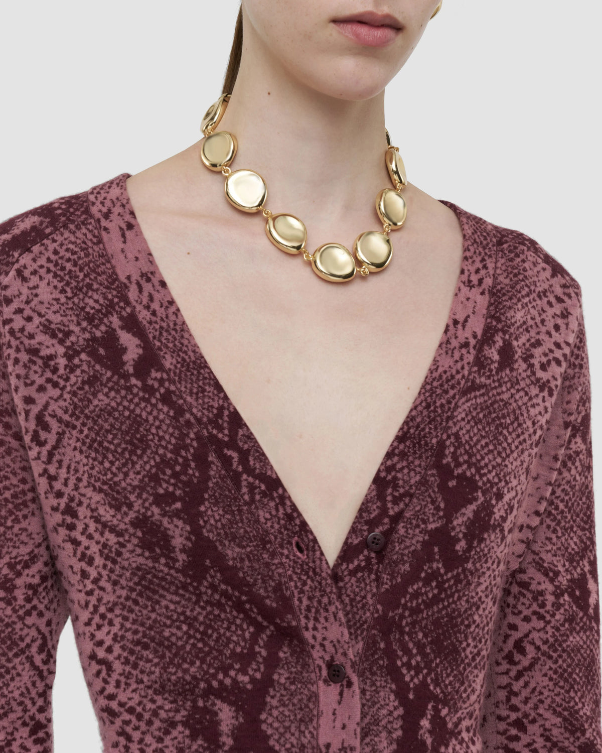 JOSEPH Aisha cashmere V-neck cardigan in plum snake jacquard, close-up at Christensen Copenhagen Sydney