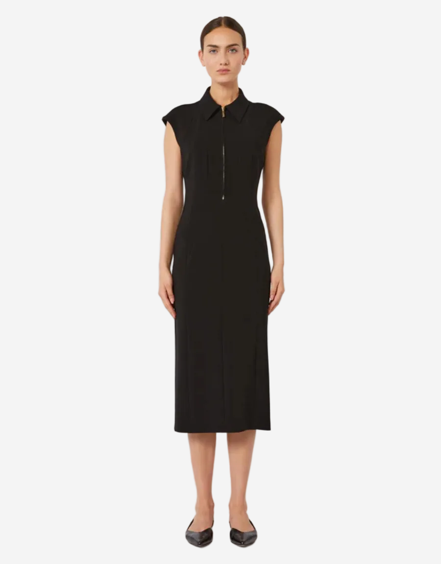 Woman wearing a black dress against a white background