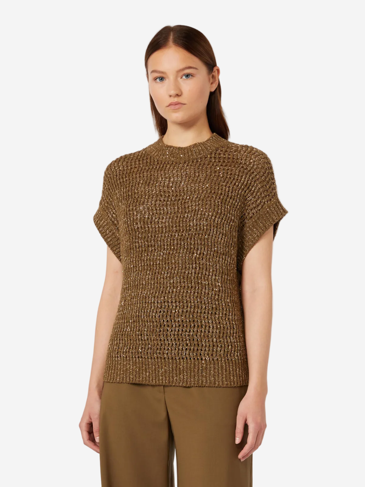 Woman wearing a brown knitted top and pants on a white background