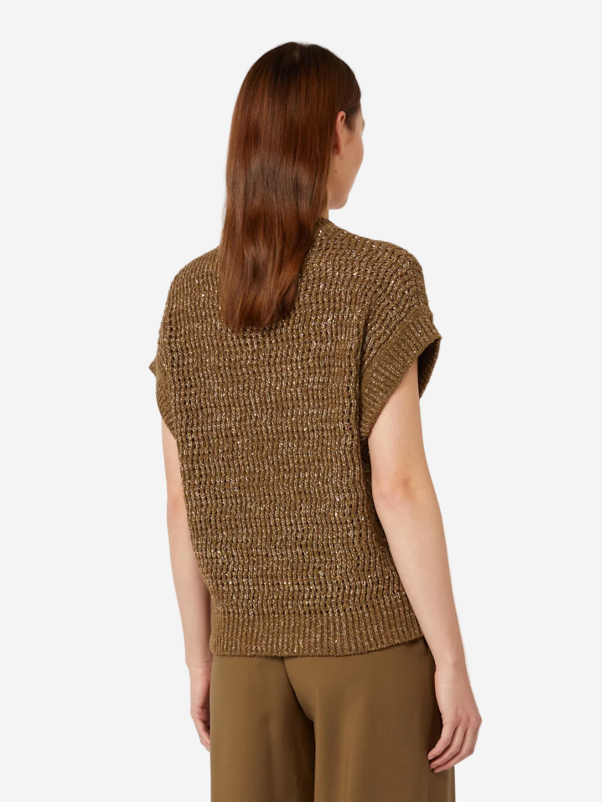 Woman wearing a brown knitted sleeveless top and pants on a white background