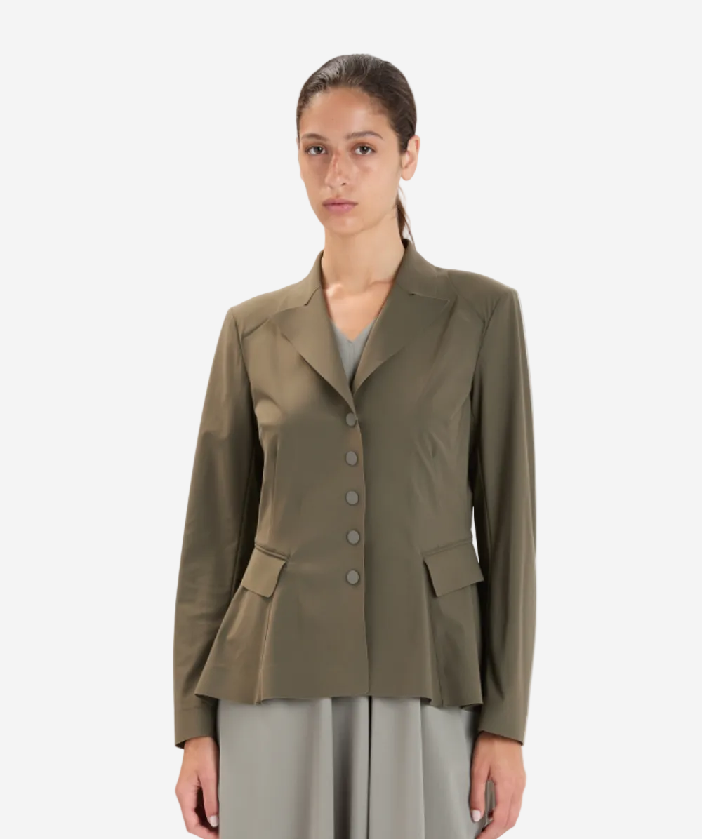 Woman wearing a green jacket on a white background