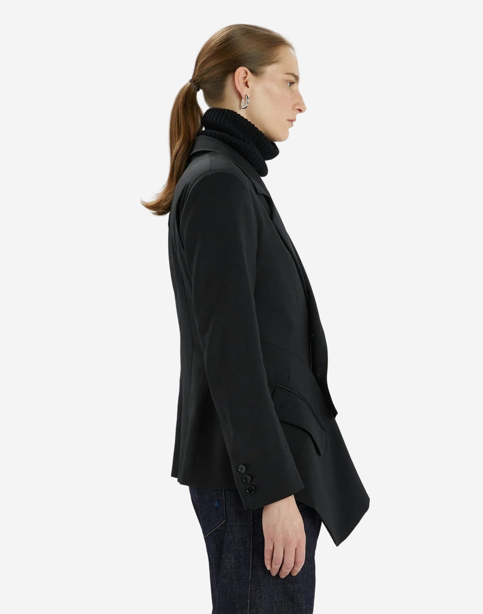 Person wearing a black coat on a white background