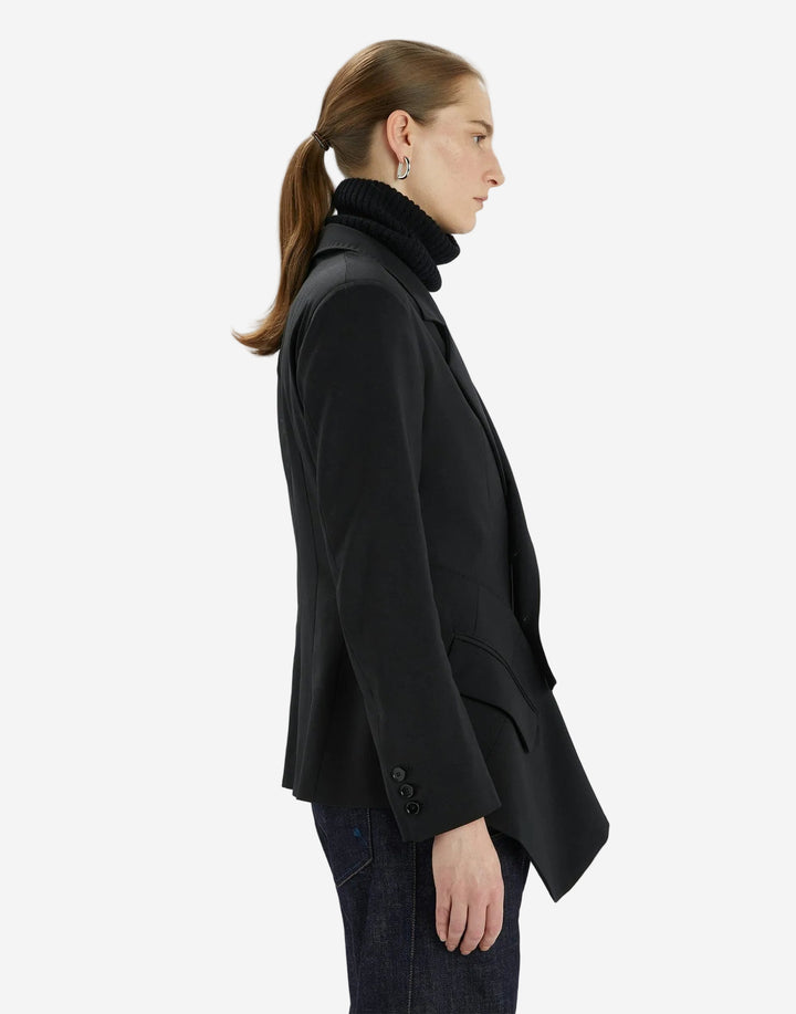 Person wearing a black coat on a white background