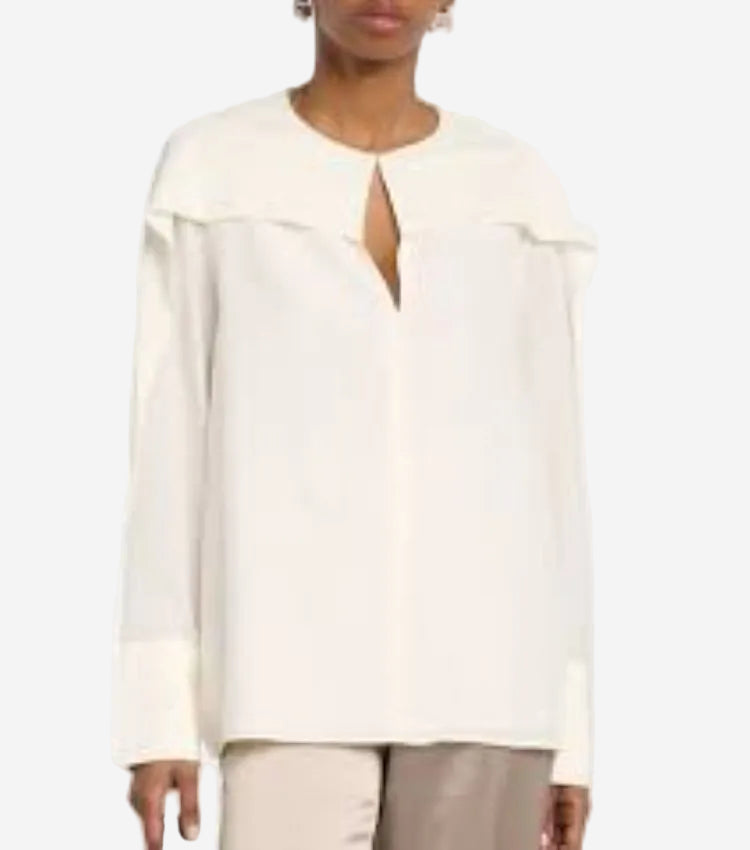 A white, long-sleeved blouse with a keyhole neckline and a straight hem.