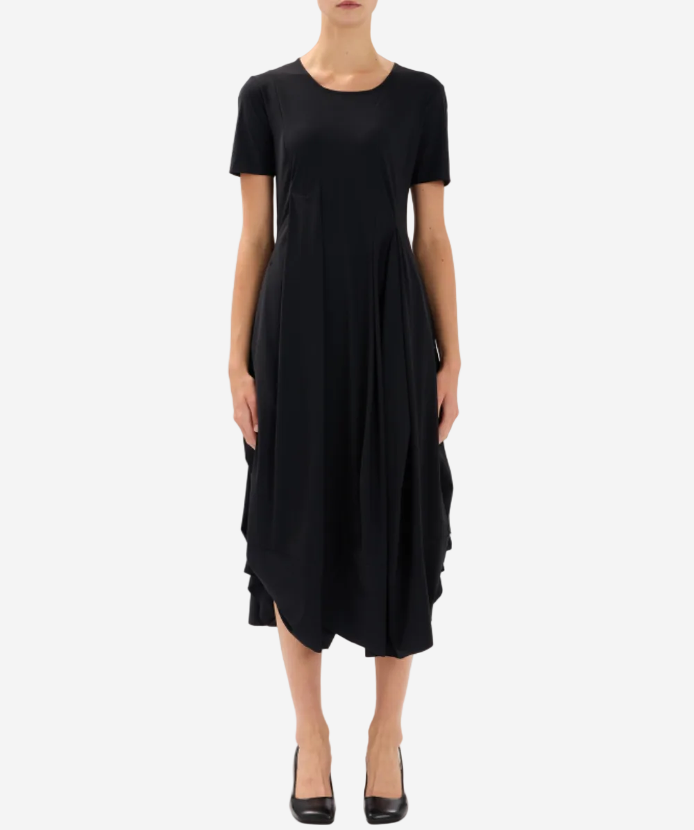 Black dress worn by a person on a white background
