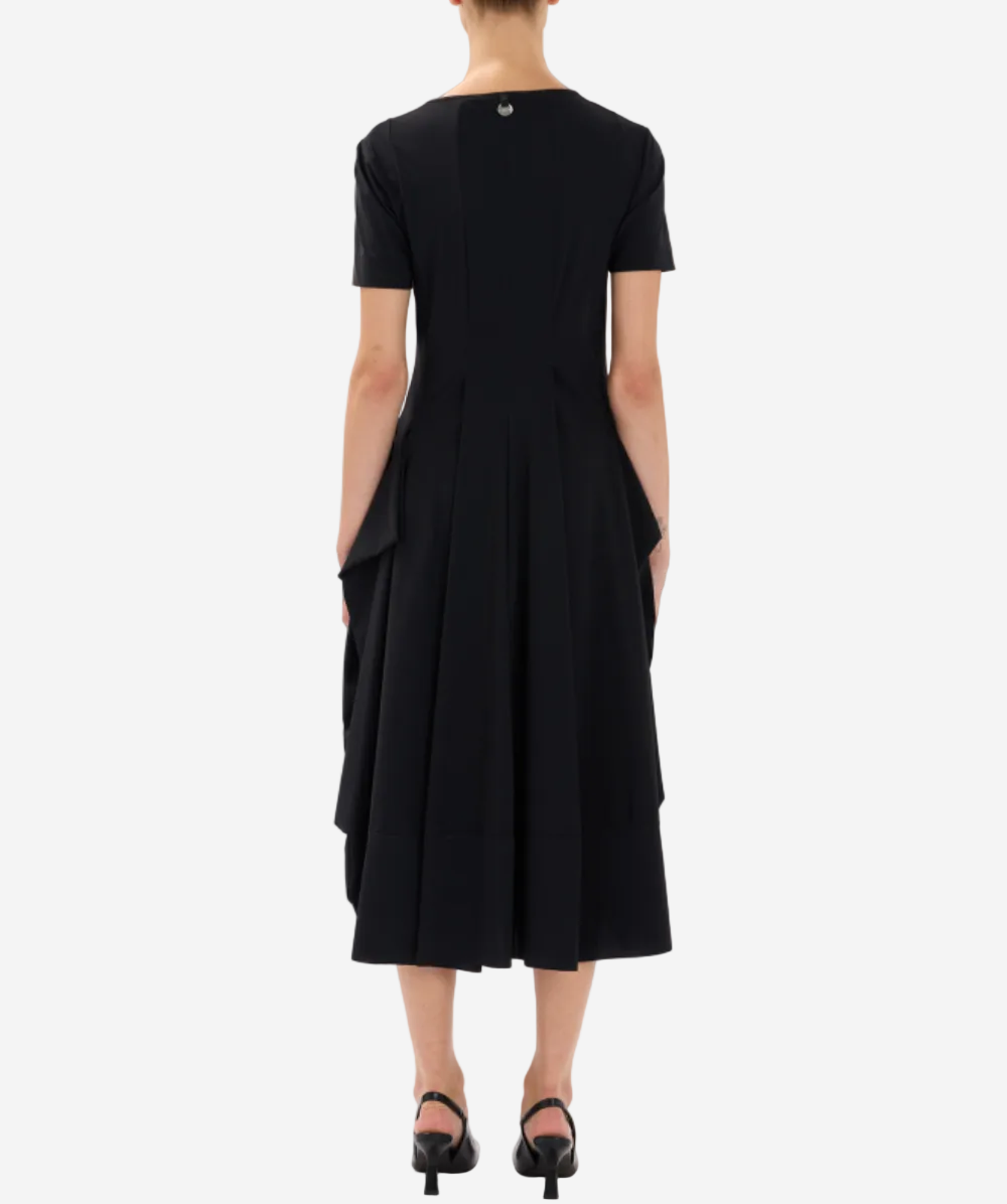 Black dress with a draped design on a white background