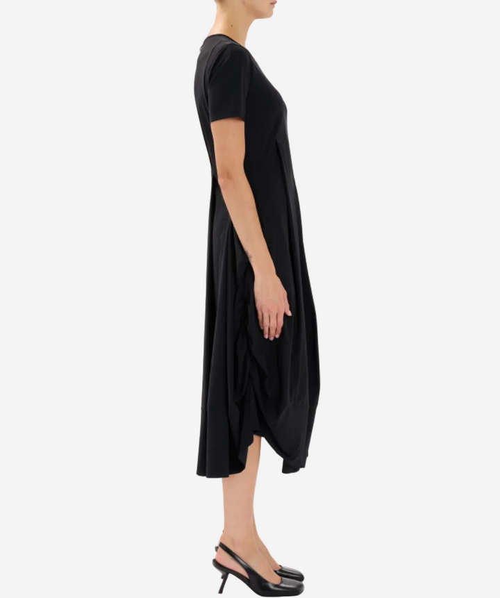 Black dress worn by a person on a white background