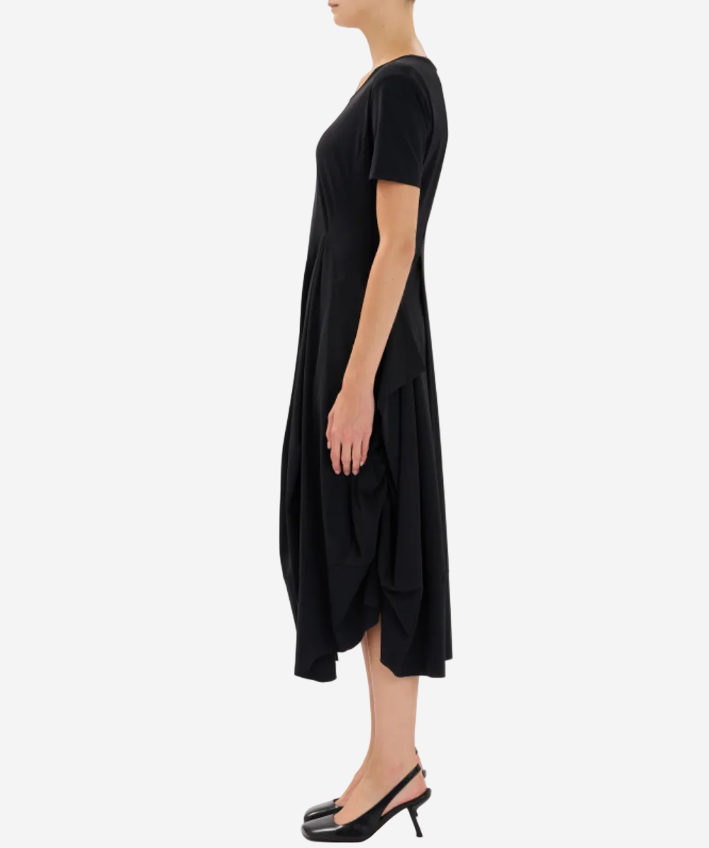 Black dress worn by a person on a white background