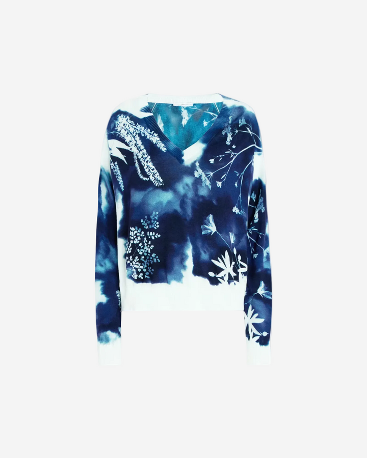 Blue and white floral patterned sweater on a white background