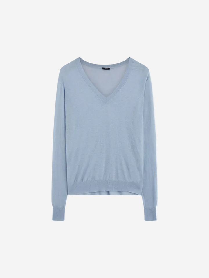 A sky blue Cashair V-neck long-sleeve sweater.