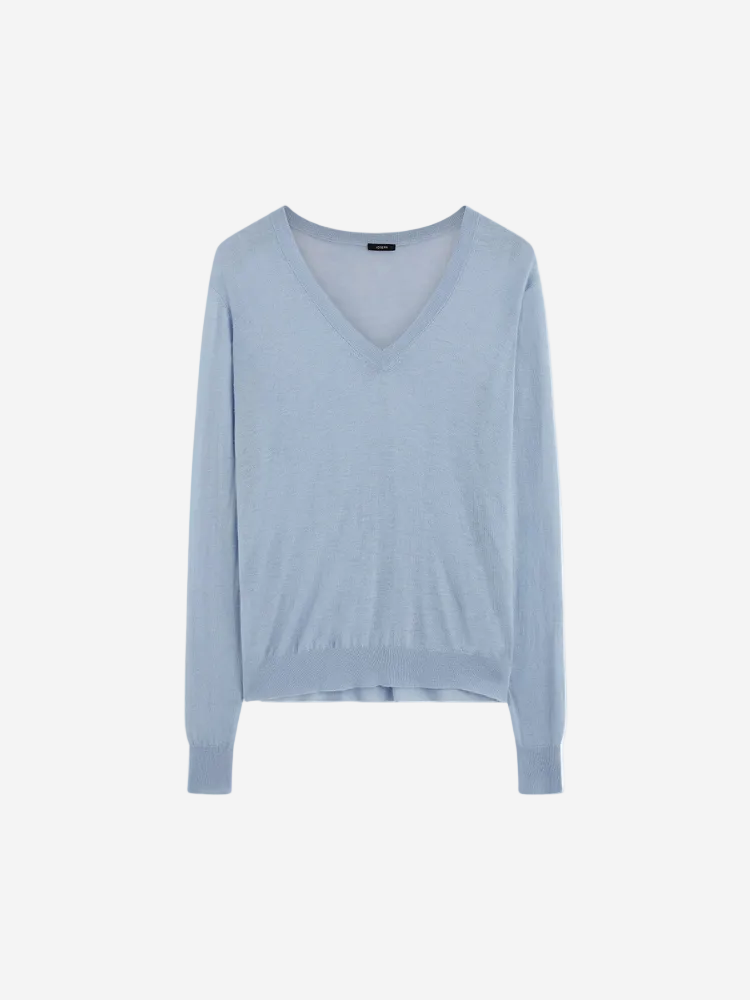A sky blue Cashair V-neck long-sleeve sweater.