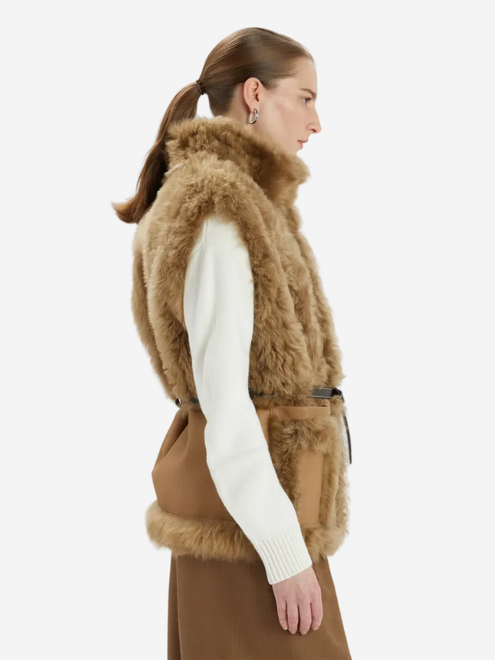Woman wearing a brown fur vest on a white background