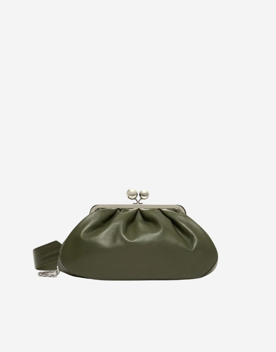 Green clutch bag with a silver clasp on a white background