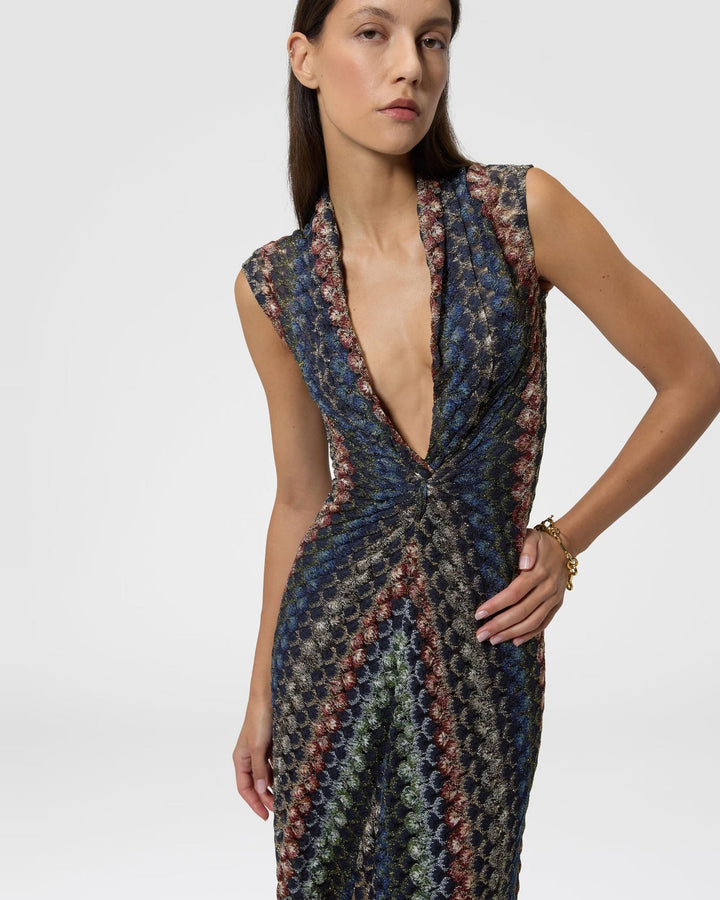 Close-up of the plunging V-neck and twist-knot detail on the Missoni metallic lace maxi dress