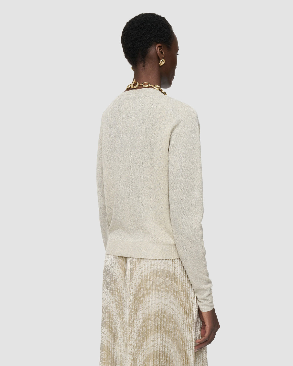 Back view of the JOSEPH Doris cardigan in champagne metallic knit showing the saddle sleeves