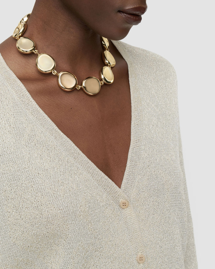 Close-up of the fine-gauge champagne metallic knit and V-neck on the JOSEPH Doris cardigan
