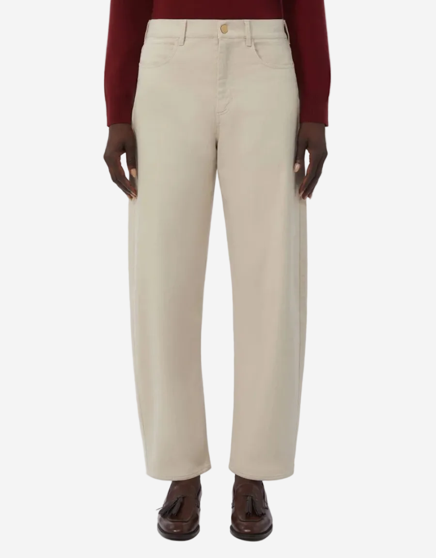Beige pants worn by a person on a white background