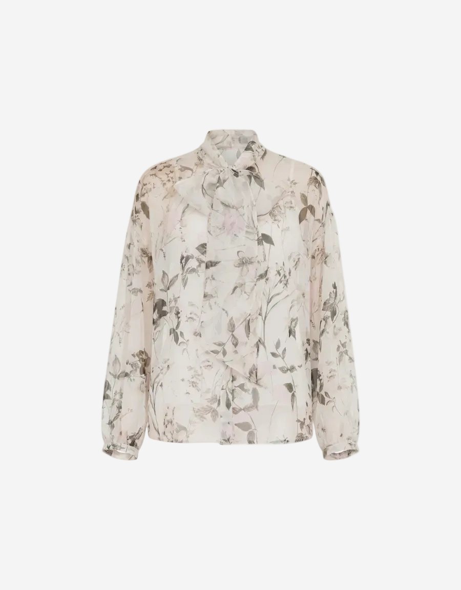 Floral patterned blouse on a white background