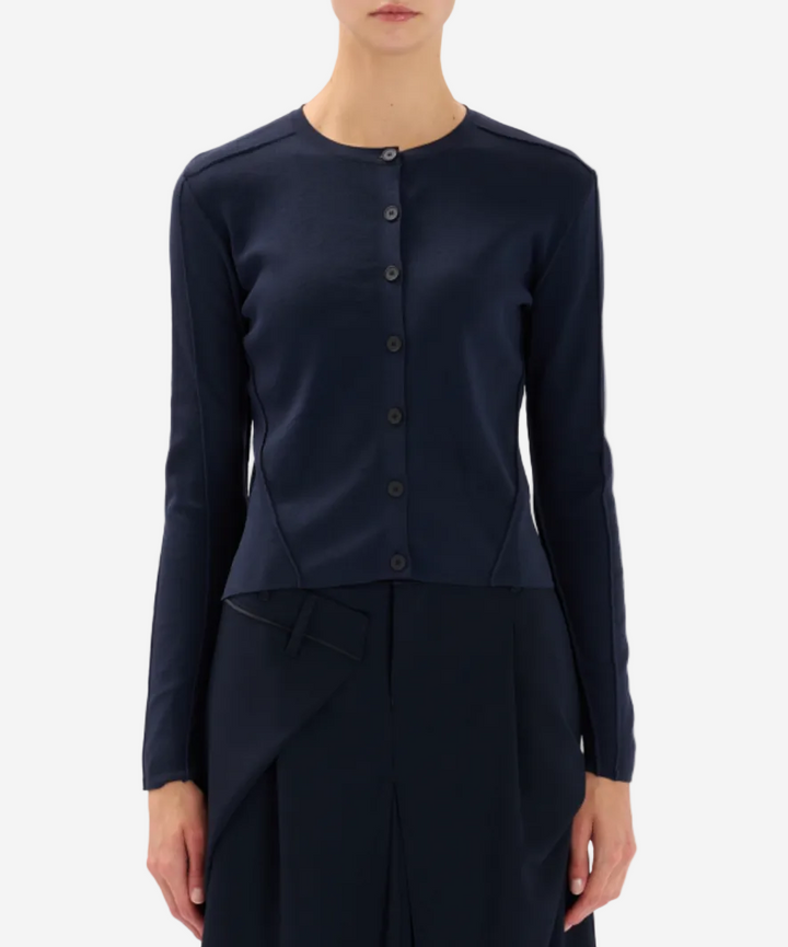 Navy blue long-sleeve top with button details on a white background