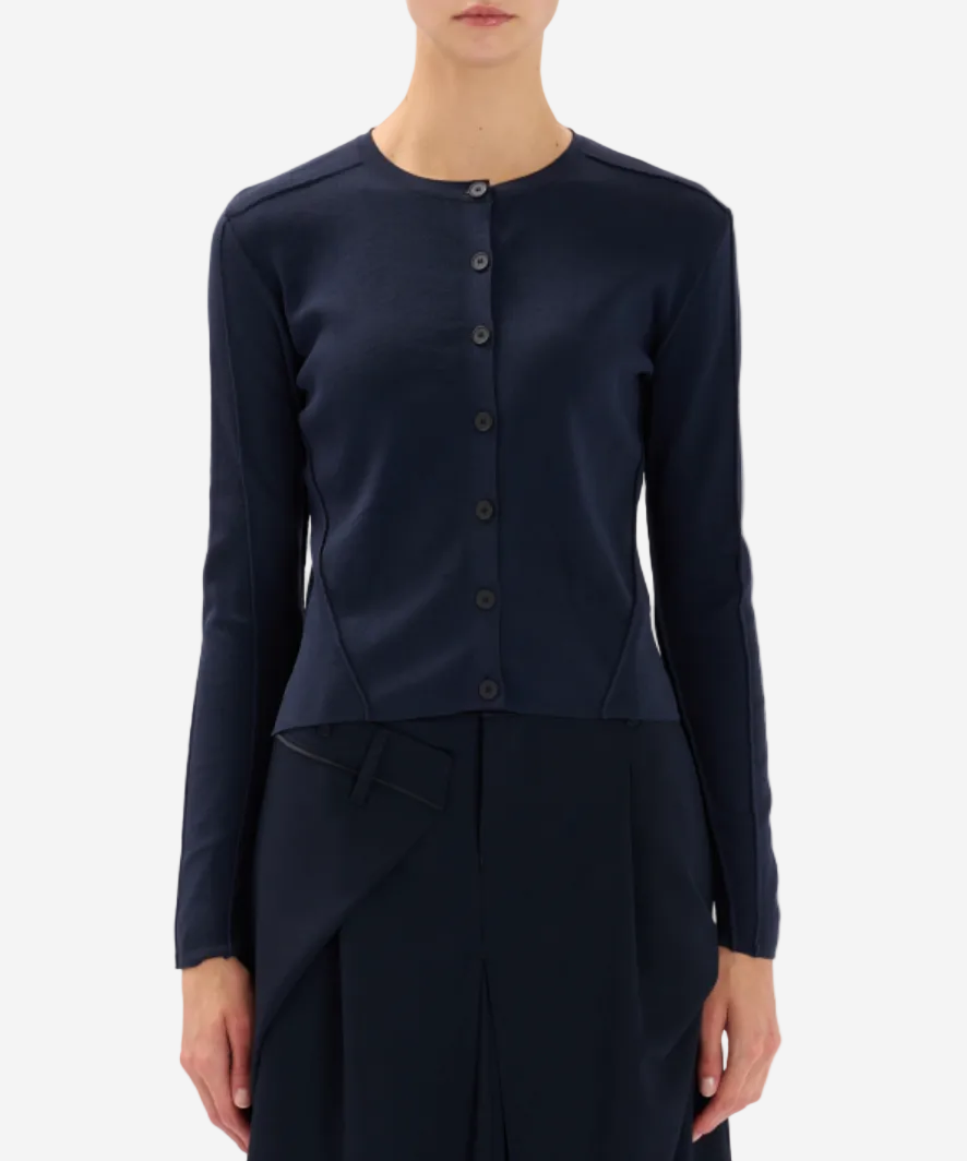 Navy blue long-sleeve top with button details on a white background