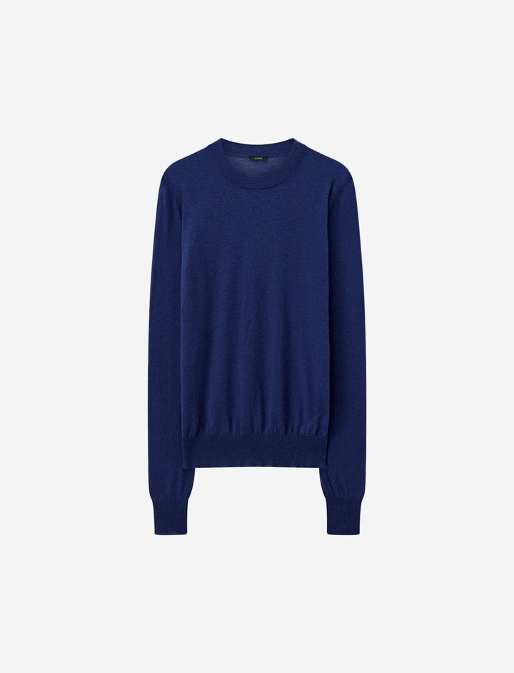 Blue sweater on a light gray background
