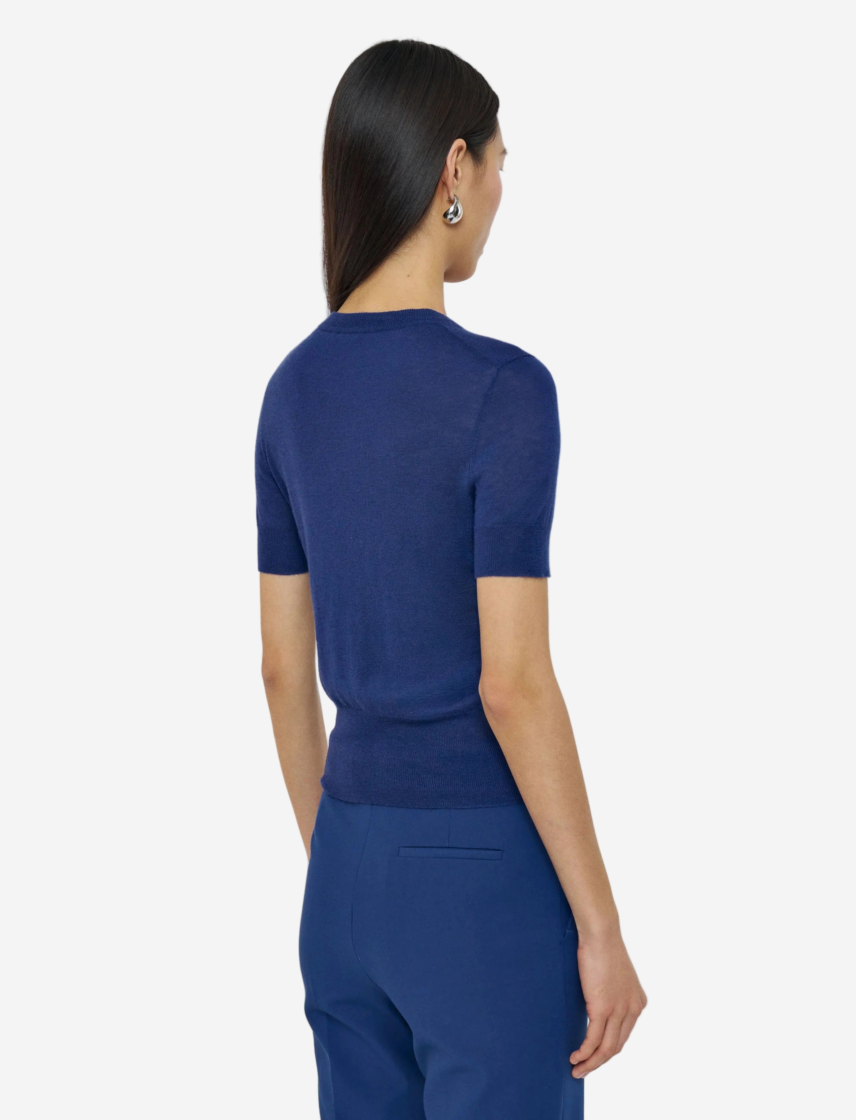 Woman wearing a blue outfit on a white background