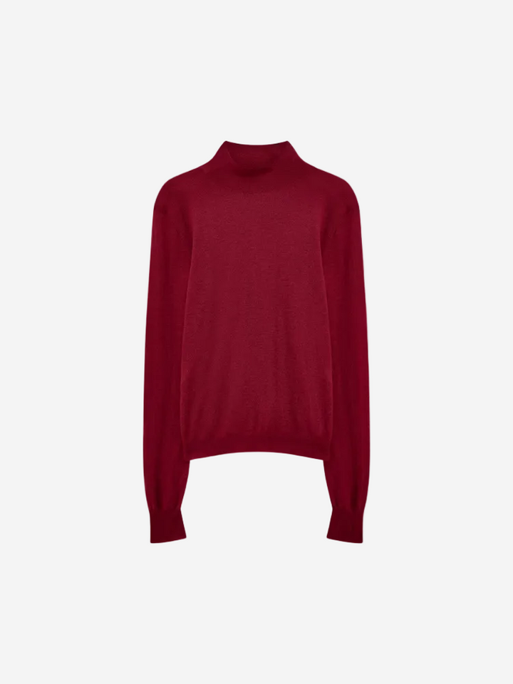 Red turtleneck sweater on a white background