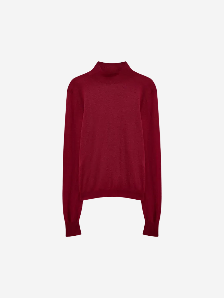 Red turtleneck sweater on a white background