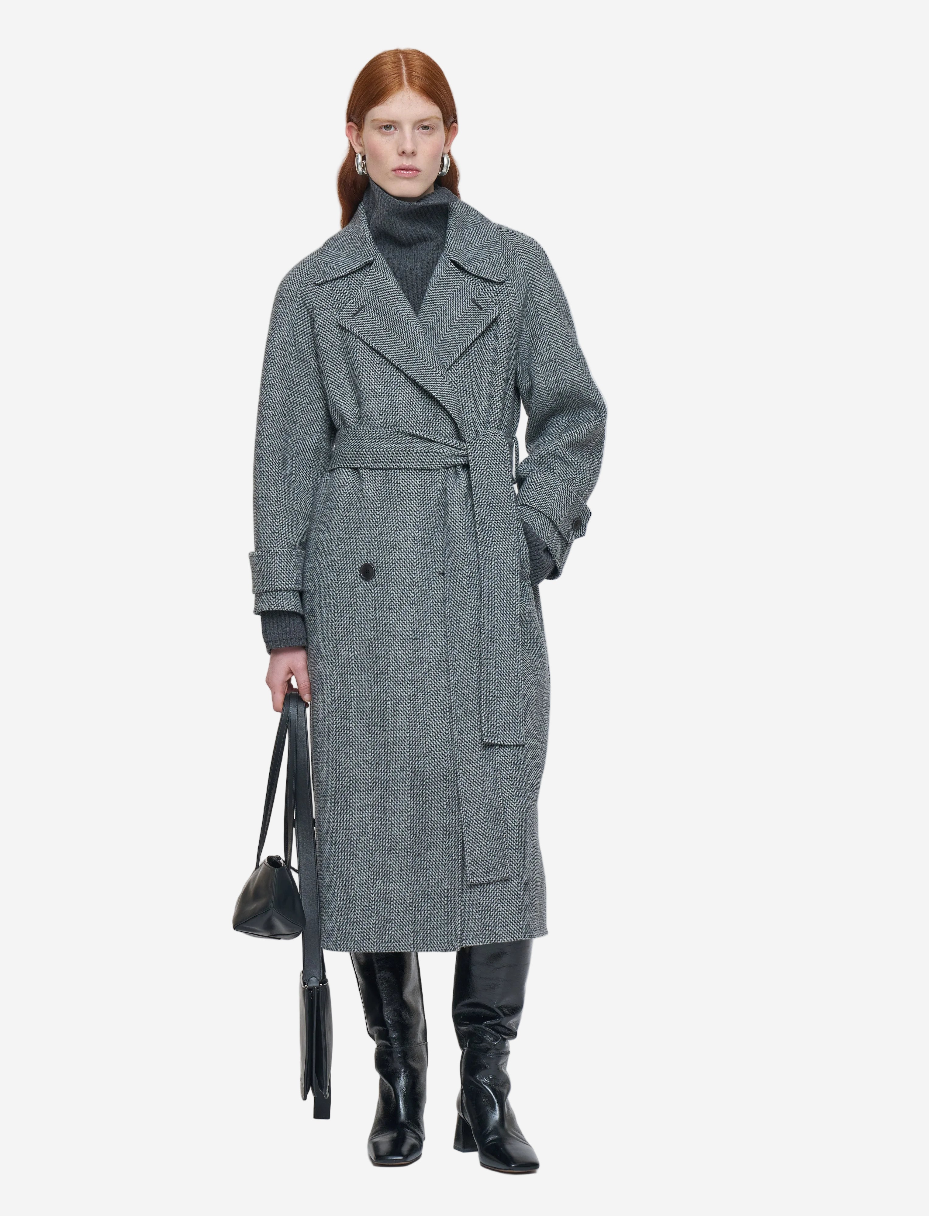Woman wearing a gray coat with a white background
