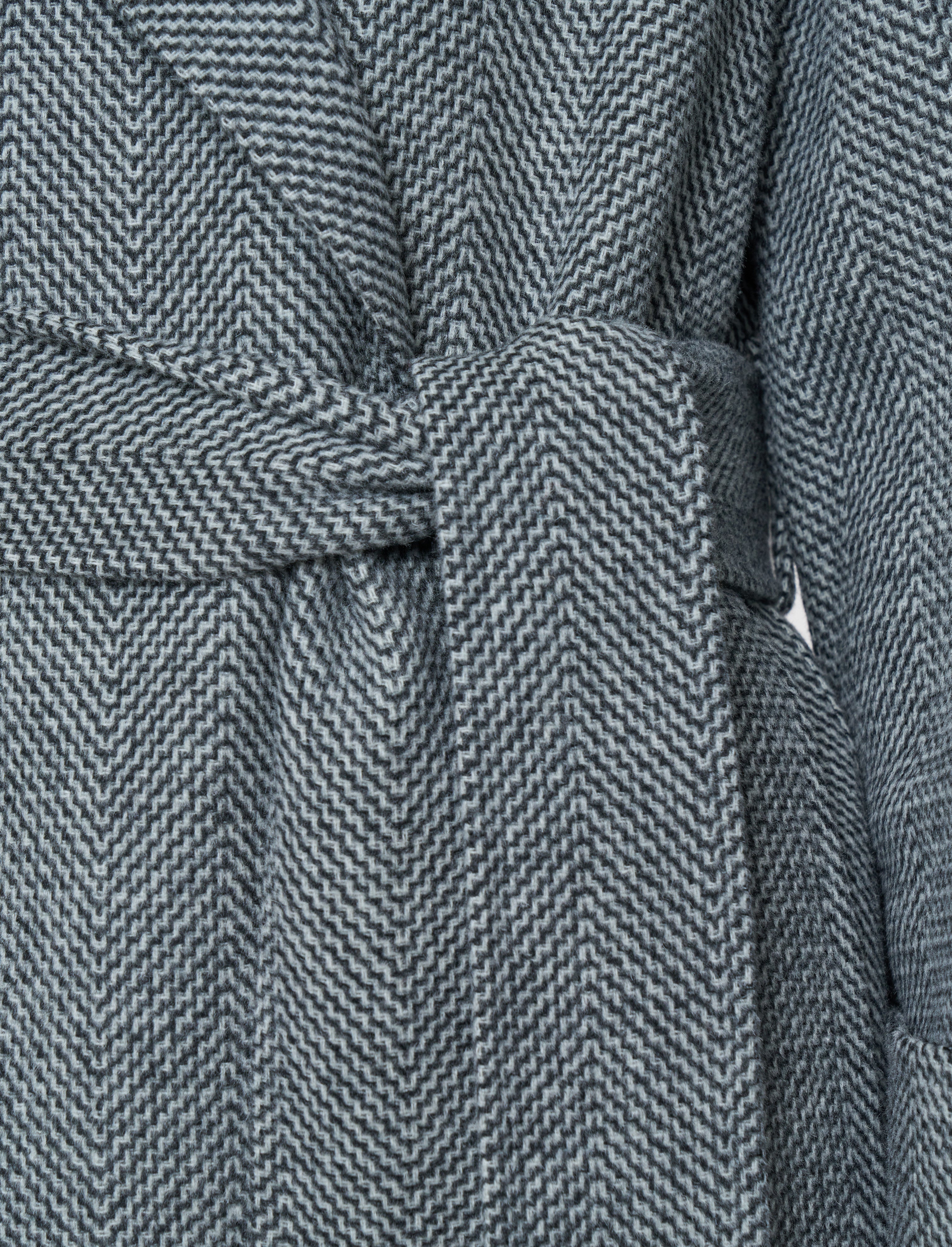 Close-up of a textured gray fabric with a pattern