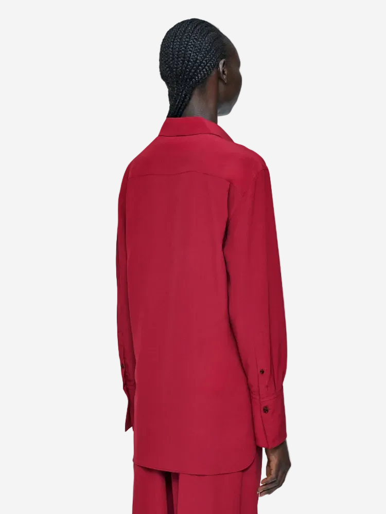 Person wearing a red outfit on a white background