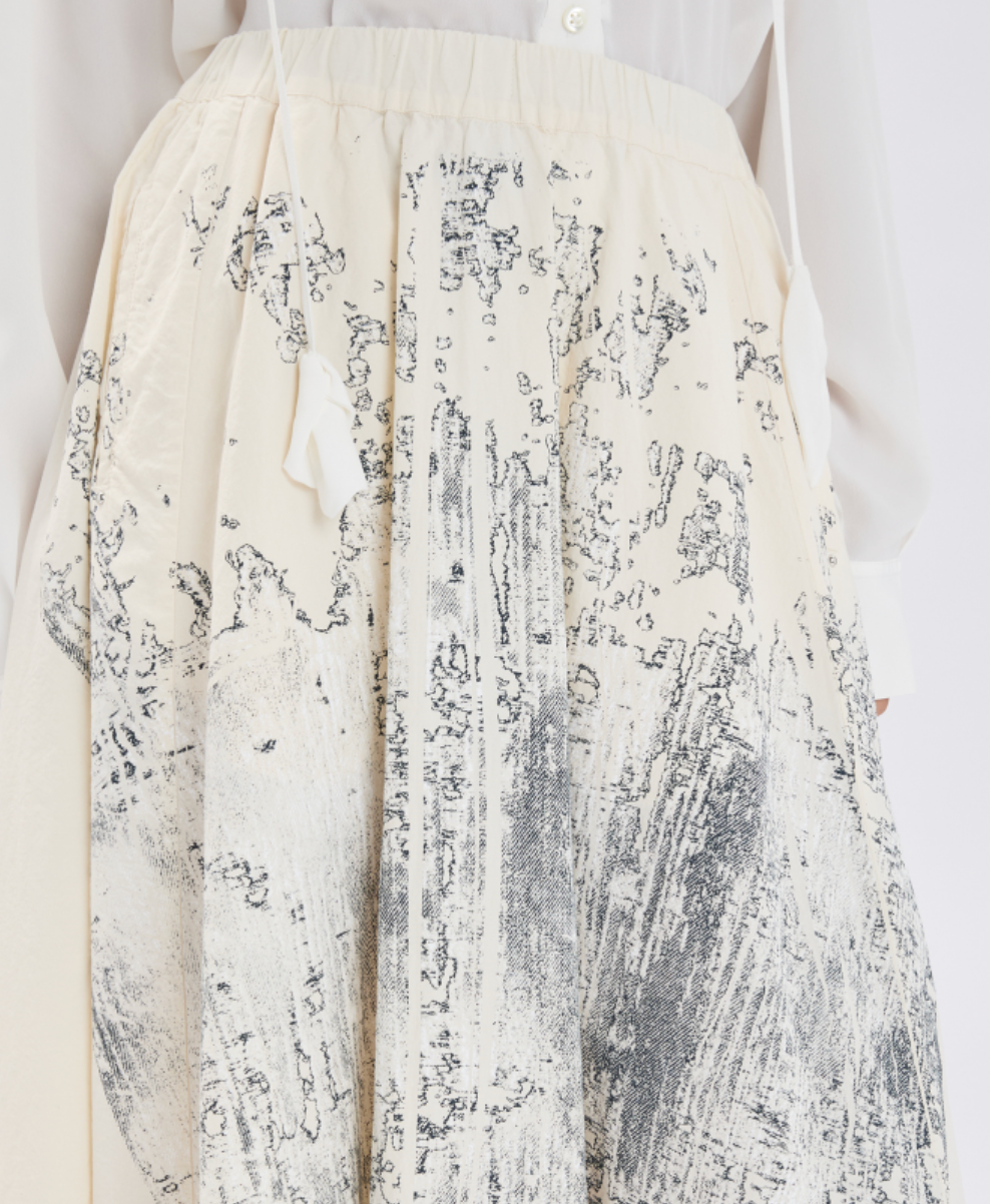 White dress with black abstract pattern on a white background