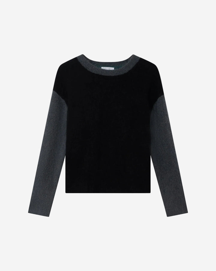 Black sweater with gray sleeves on a light gray background