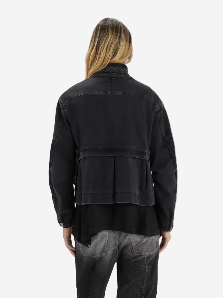 Person wearing a black jacket on a white background