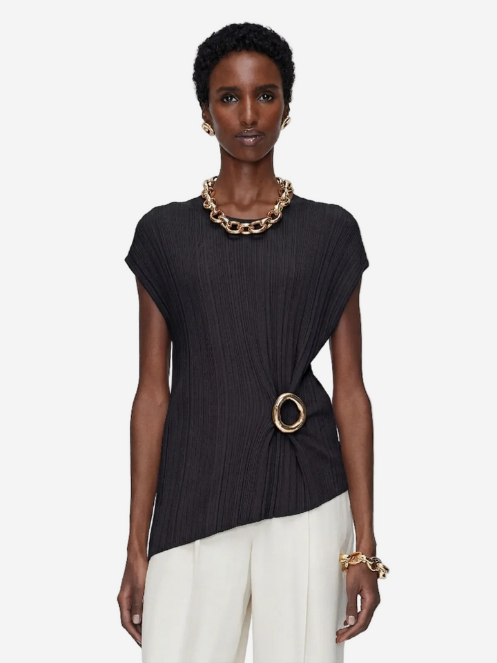 Model wearing a black top with a gold necklace and bracelet on a white background available in Australia at Christensen Copenhagen