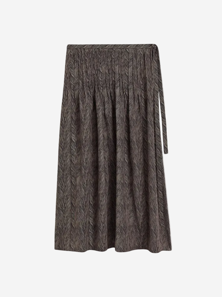 A mid-length brown skirt with a side tie and invisible side zip, crafted from crepe de chine fabric.